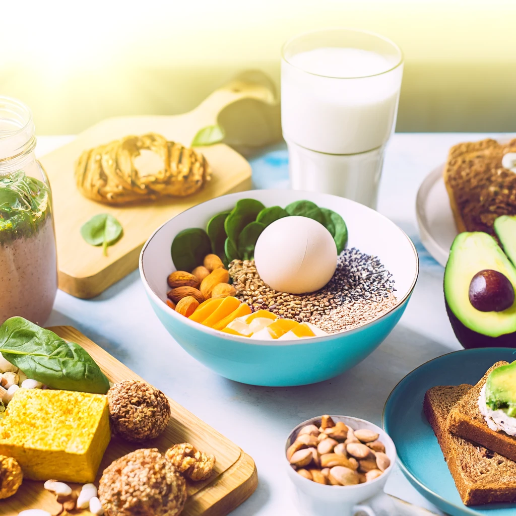 A vibrant and appetizing image for a blog cover, depicting an array of high-protein breakfast dishes ideal for athletes